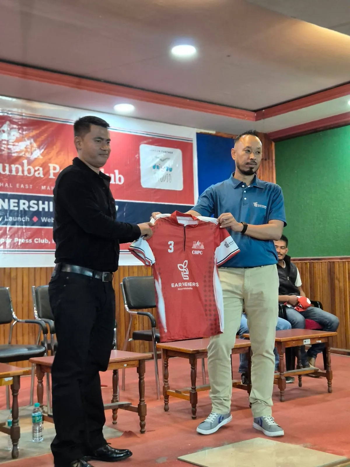 Soraisam Devakishor Singh of Eartheners hands over a jersey for the 2026–27 season, 07-10-2026.